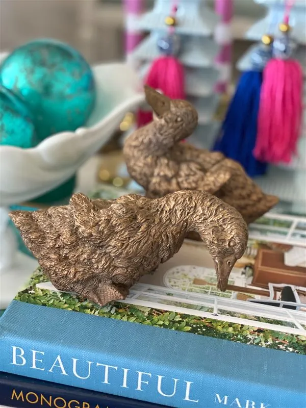 Pair of resin bronze colored ducks